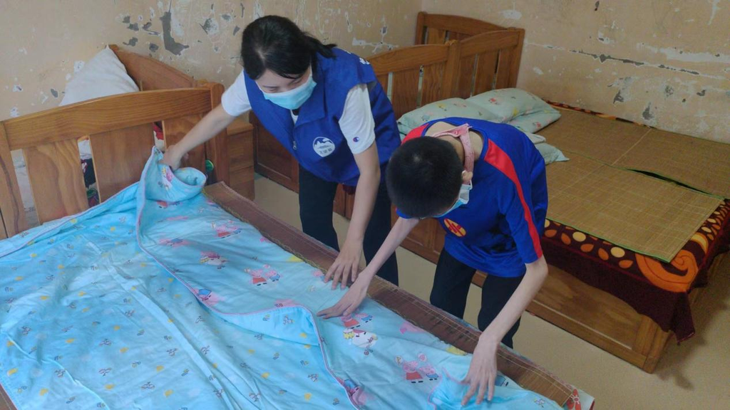 郑州市儿童福利院开展"叠被子 显身手"主题活动